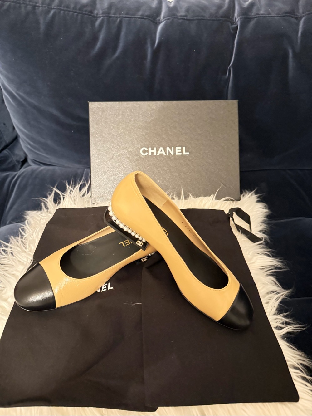 CHANEL Tan Leather Ballet Flats with Black Cap Toe and Pearl Heel Trim